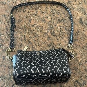 Used black purse with white flower print
